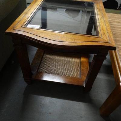 Wooden end table with glass top.