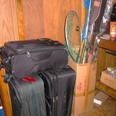 luggage and nice group of fishing rods and reels