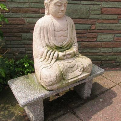 Cement Buddha and granite bench