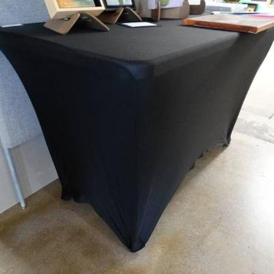Small plastic table with folding legs and table co ...