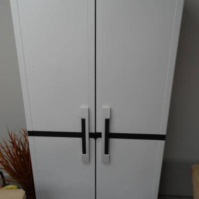 Large plastic 2 door storage cabinet.