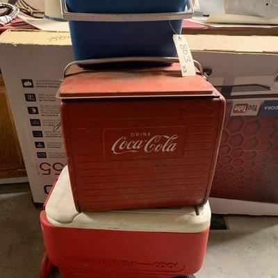 803: 	
Vintage Coca Cola cooler and 2 more ice chests
Vintage Coca Cola cooler and 2 more ice chests