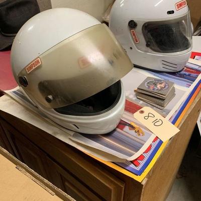 810: 2 Simpson racing helmets and vintage racing posters
2 Simpson racing helmets and vintage racing posters