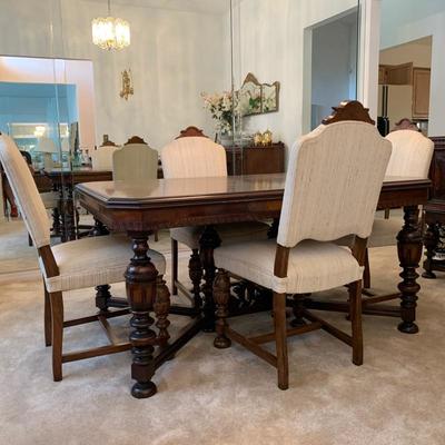 West End Furniture Co. antique dining table and chairs. Approximately 100 years old in excellent condition. Table measures 45 x 60