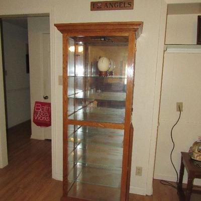One of two matching curio cabinets