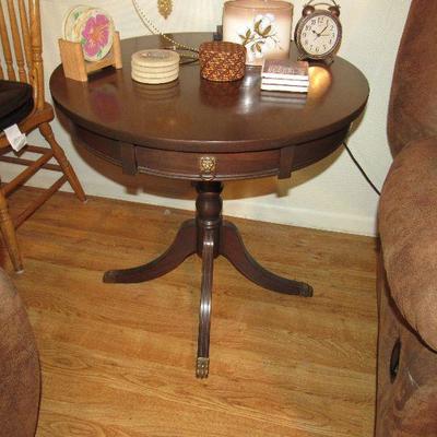 Round antique table with drawer