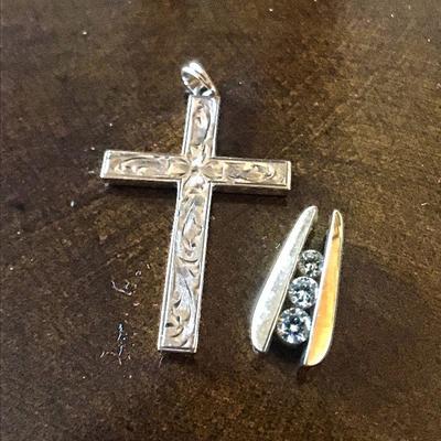 10k gold pendant. Cross @ $20 and 3-diamond pendant @ $300.