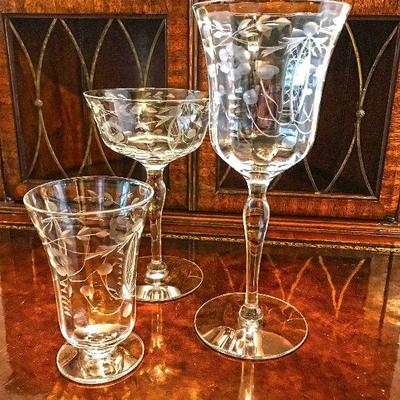 Various vintage etched crystal glasses. 3 wine glasses. 8 champagne. 5 smaller glasses. $5 each.