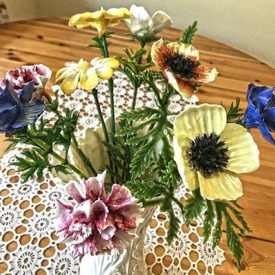 10 Individual porcelain flowers on stems. $24 for bunch or $2.50 each