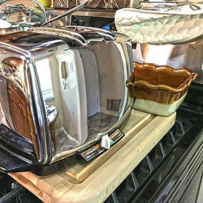 Vintage Sunbeam toaster Radiant Control. Sold online for approx $100-120. Estate sale price: $50 In back, Emile Henry Ruffled Loaf Pan @ $20