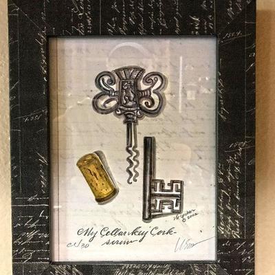 Framed cellar key corkscrew drawing.