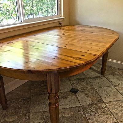 Round and oval pine table. Includes 2 leaves. $100