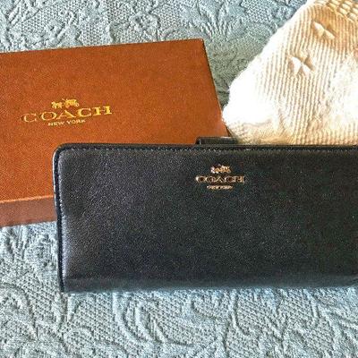 Coach never used. with box. $75