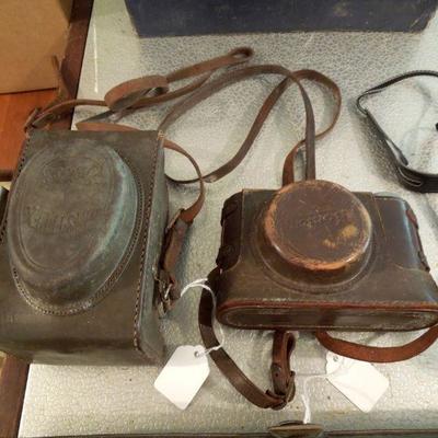 Vintage SLR and box camera in leather case