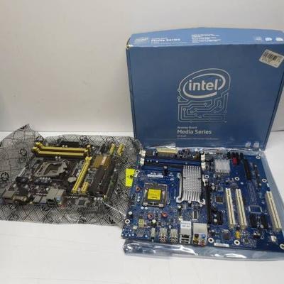 Lot of 2 motherboards, 1 with box and box contents