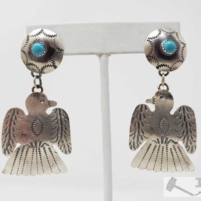 328: Tim Yazzie Navajo Turquoise & Sterling Silver Thunderbird Dangle Earrings, 11.8g
These are a pair of Navajo Sterling Silver &...