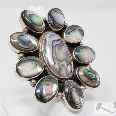 334: 	
Large Sterling Silver Albacore Ring, 34.3g
This is a beautiful Abalone and Sterling silver Navajo cluster ring.
It is a size 8.5....