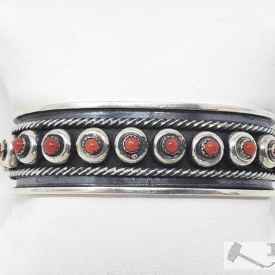322: 	
Navajo Coral & Sterling Silver Snake Eye Cuff Bracelet Signed And Stamped, 36.7g
This is a beautiful handmade Navajo Coral and...