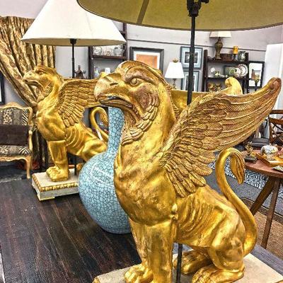 An early 20th century impressive pair of Swedish gilt Gryffons on painted and gilt pedestals. Old European fittings for electricity still...