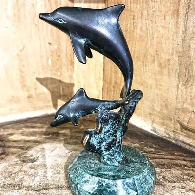 Small bronze dolphins on a marble stand by SPI. 6