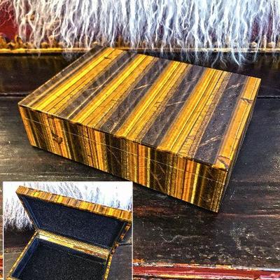 Natural tiger eye box with lid. Black felt interior and brass hinge. Excellent condition. $650
