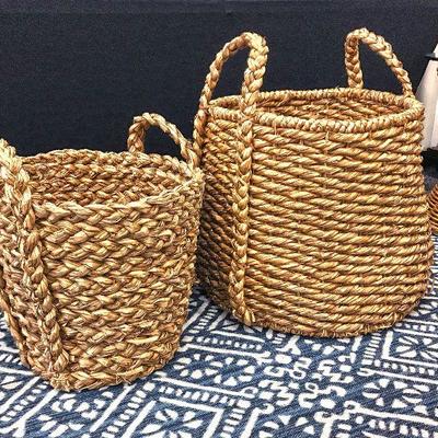 Very large baskets with braided handles. 