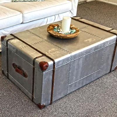 Aviator coffee table. Metal wrapped with leather details. Drawers on each side pull out. Handle of drawers is leather.