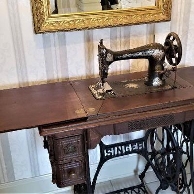 Antique Singer sewing machine with awesome base.