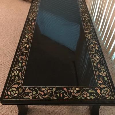 Lacquer Oriental coffee table 57 long x 23 w x 14 tall 