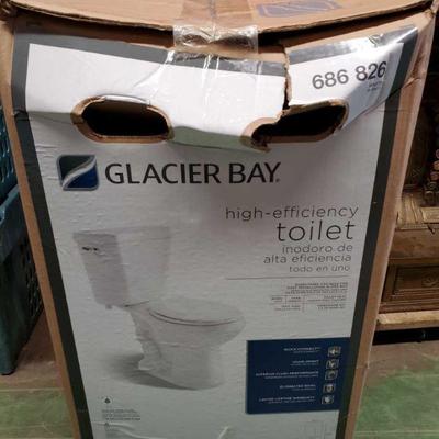 6950: 	
Brand New Glacier Bay Toilet
NEW IN BOX! A beautiful elongated high efficiency toilet by Glacier Bay, item 686 826 is a two-piece...