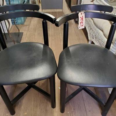 7023: Two Leather Cushion Black chairs with back supports
Two Leather Cushion Black chairs with back supports