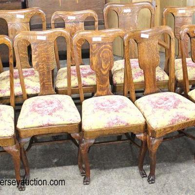  ANTIQUE 11 Piece Oak Dining Room Set

Table with 6 Leaves and 10 Upholstered Seat Chairs

Auction Estimate $300-$600 â€“ Located Inside 