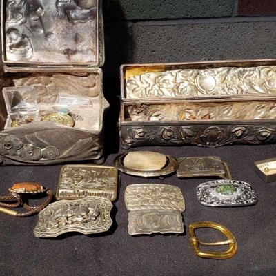 750: 2 Metal Jewelry Boxes, Belt Buckles, Bolo Tie, Pins, and More
2 Metal Jewelry Boxes, Belt Buckles, Bolo Tie, Pins, and More