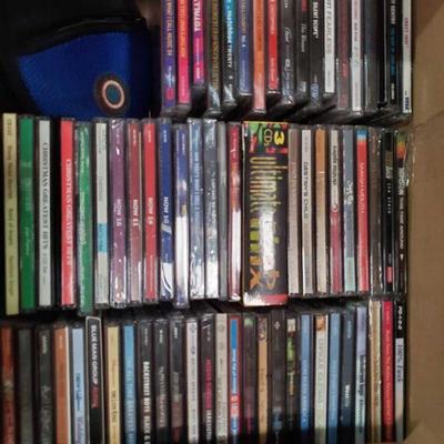 1236: 2 Boxes of CDs and a CD Holder
Including Taylor Swift Fearless, Totally Hits 2001, Montgomert Gentry So.ething to be Proud of,...