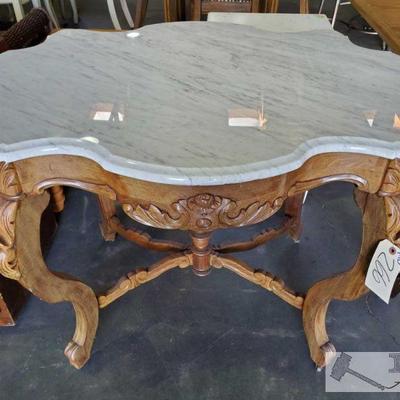 266: Carved Wood Decor Table on casters w/ Table shaped Marble top
Carved Wood Decor Table on casters w/ Table shaped Marble...