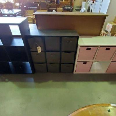 274: Three Storage Units with Fold up Bins, two Push carts with shelfs
Two black storage cabinets that hold Fold up fabric bins(bins...