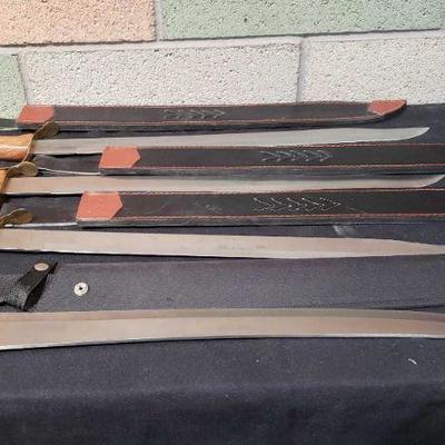 976: 4 Swords, 3 of the Same Swords and Frost Cutlery Sword
Blade Length: 21.75