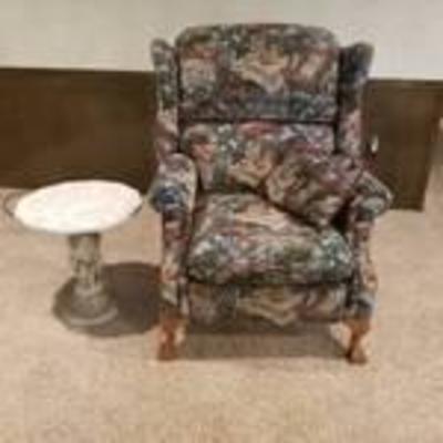 Beautiful upholstered recliner with big claw feet