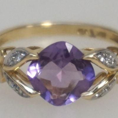 14K Yellow Gold Amethyst and Diamond Ring. Size 7.25. 1.80 dwt. Center stone cushion cut Amethyst 8.00 mm. Side stones 8 round brilliant...