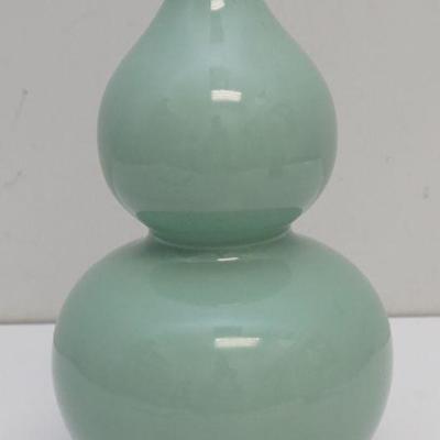 A Fine Celadon-Glazed Double-Gourd Vase. Qing mark. 