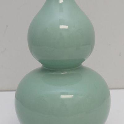A Fine Celadon-Glazed Double-Gourd Vase. Qing mark. "Jian Ding" 