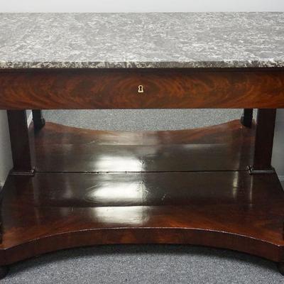A very finely figured French Charles X period c. 1820 mahogany console table, one central drawer, mirrored back, supported upon two...