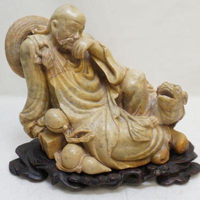Republic Era Chinese Finely Carved Soapstone Sculpture of a reclining Scholar and Shishi. On carved rosewood stand. Sculpture...