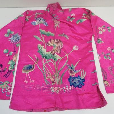 A exquisite Chinese embroidered and needlework jacket c.1920s. Brilliant Fuschia silk ground. Embroidered needlework with colorful silk...