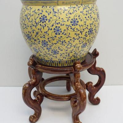 Large 20th c. Chinese Fish Bowl on stand. Yellow with blue floral scrolling vine. Hand painted interior. Measures 27