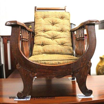  ANTIQUE Oak Childâ€™s Morris Chair

Auction Estimate $200-$400 â€“ Located Inside 