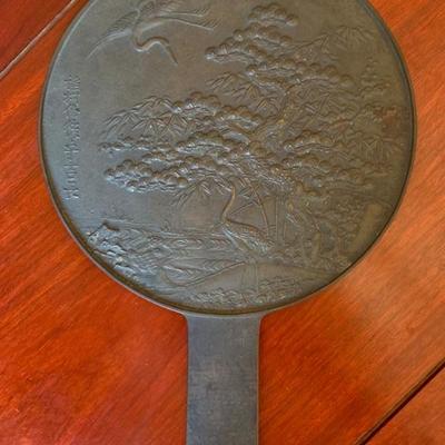 Japanese bronze mirror with cranes and floral motif