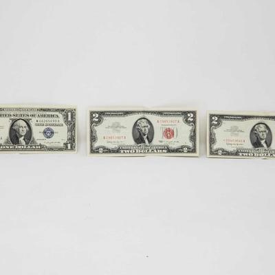 210: 1 Blue Seal $1 Bill and 2 Red Seal $2 Bills
1 Blue Seal $1 Bill and 2 Red Seal $2 Bills