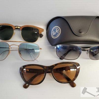 4 Pairs of Ray-Ban Sunglasses(Not Authenticated)
Two pairs polarized one w/ case, two pairs non-polarized 
OS19-026460.10