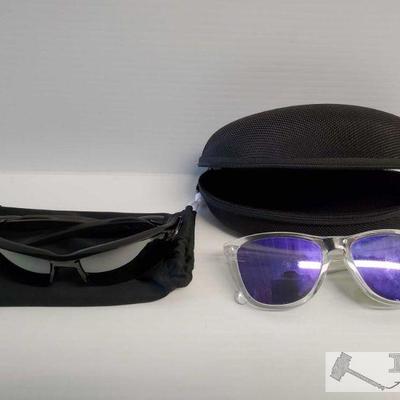 2 Pairs of Oakley Sunglasses w/ Hard and Soft Case
Models are Blake 2.0 and Frogskins 
OS19-026460.9